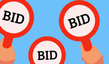 3 signs being held up, each of them reading "BID"